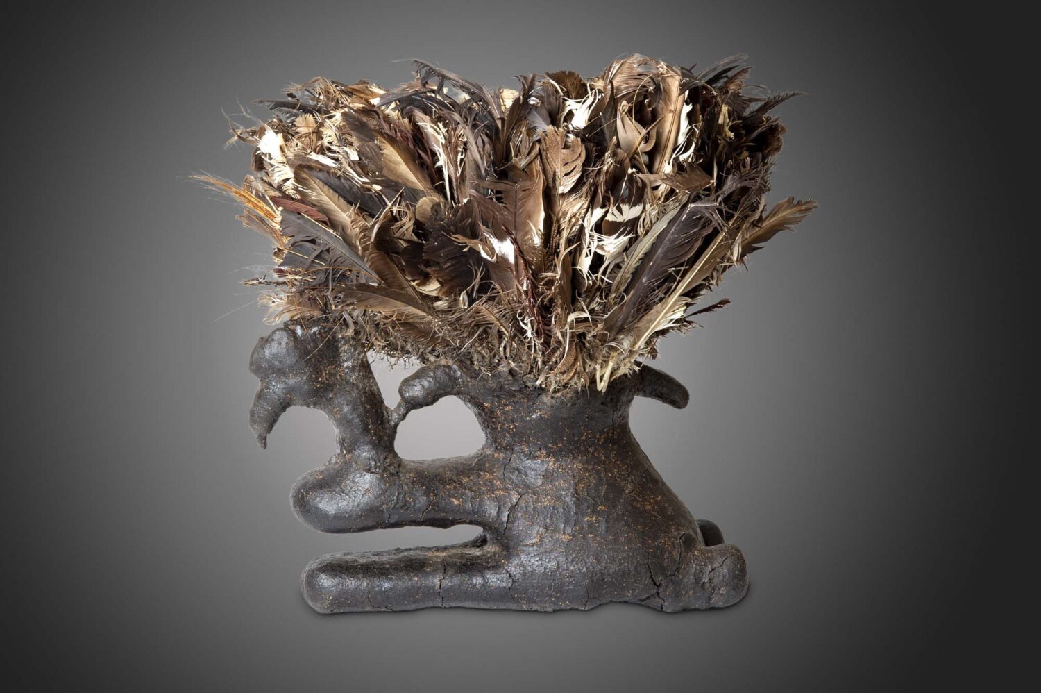 thumbnail of Komo boli made of wood, ulture feathers, bird skull, luminous brown encrustation.