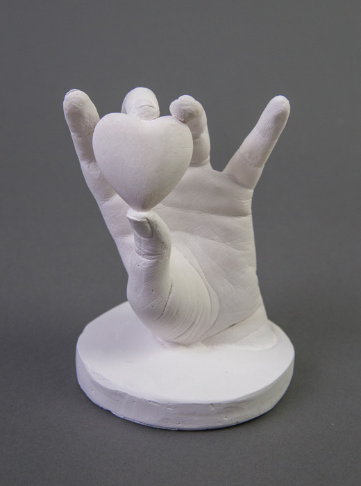 Plaster by Genesis Blanco titled Loving Touch.