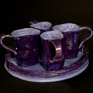thumbnail of Photograph of 4 Ceramic mugs on a ceramic server
