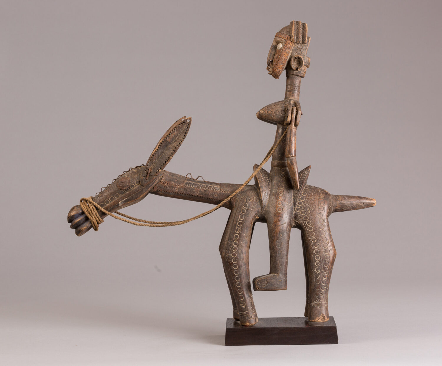 thumbnail of Sculpture of a figure on a donkey made out of wood