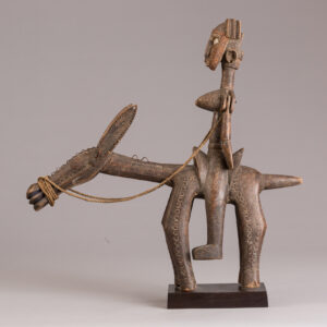 thumbnail of Sculpture of a figure on a donkey made out of wood