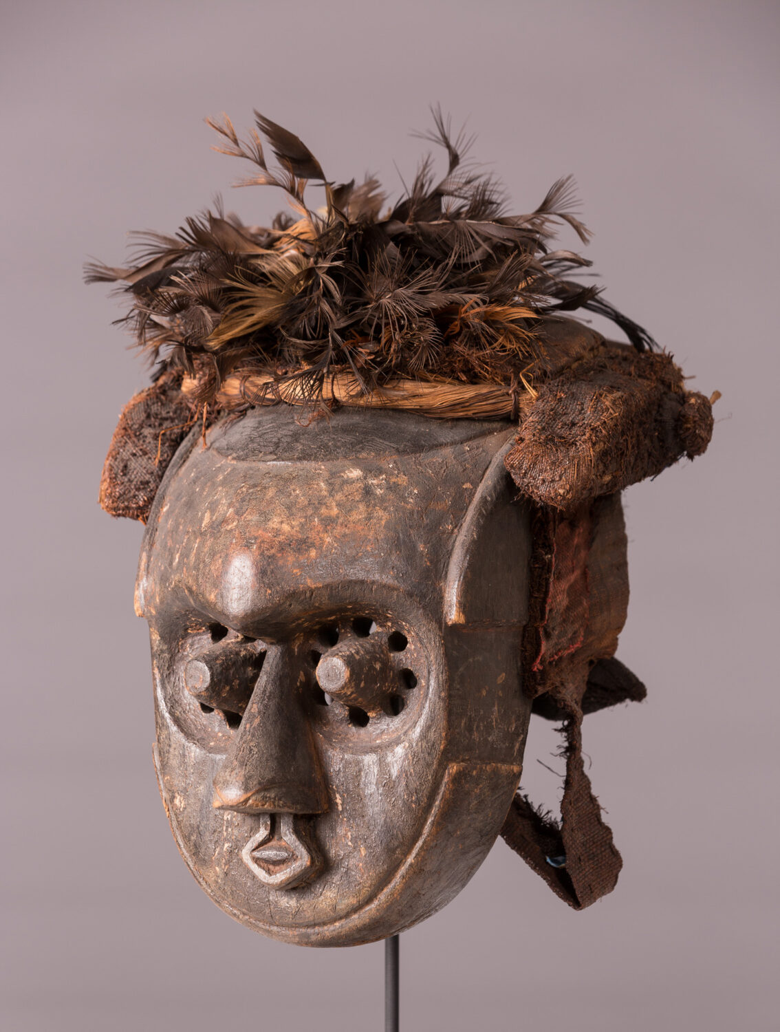 thumbnail of Mask made out off wood, feathers, textile, pigment.