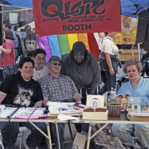 thumbnail of Photo of Members of the Queens Lesbian and Gay Pride Committee (QLGPC) at a street festival in Queens in 1993.