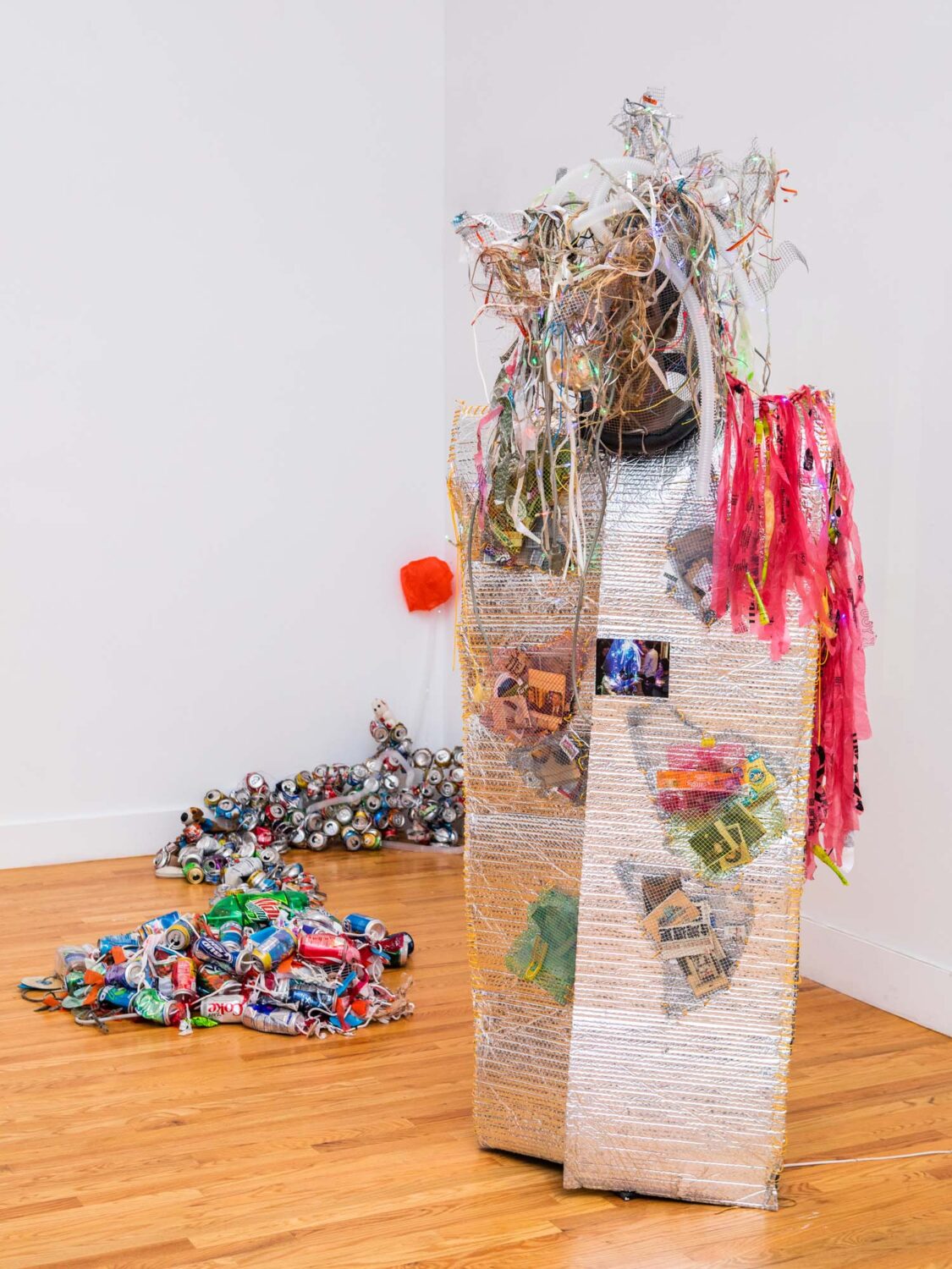 thumbnail of Custom made with LED lights, discarded refuse collected daily, the packaging of snacks consumed; old recycle clothing and shredded aluminum cans by Chin Chih Yang titled Broken Mind.