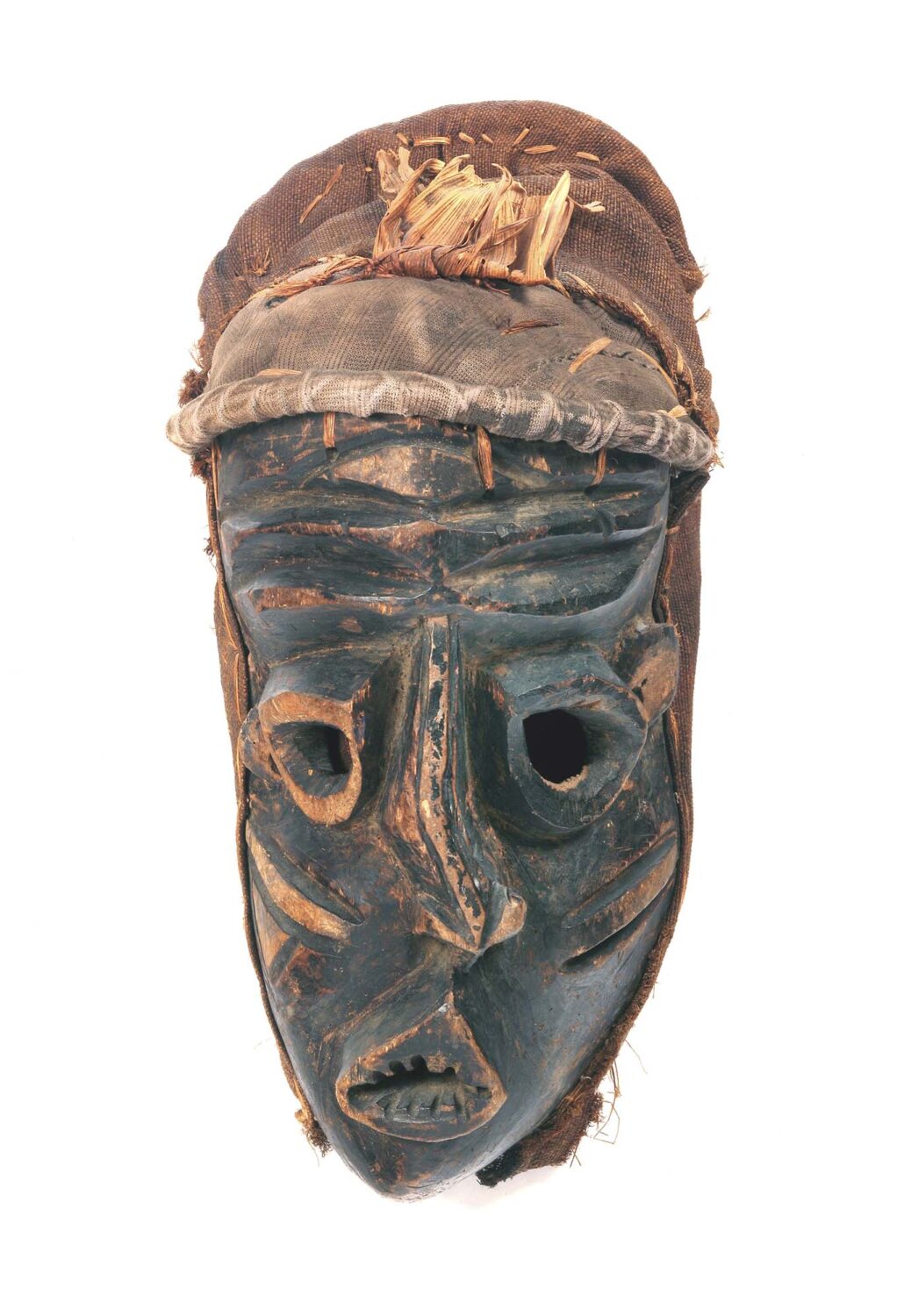 thumbnail of Mask with skewed features made with wood, black pigment and textile.
