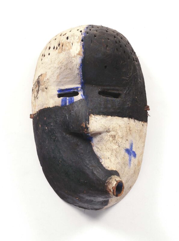 Mask showing facial distortion made with wood, black and white pigments.