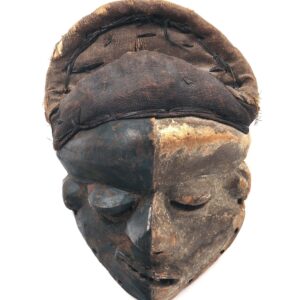thumbnail of Mbangu mask made with wood, black pigment and kaolin.