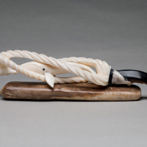 thumbnail of Sculpture made out of Walrus ivory, seal claw, fossilized by Ronald Kingeekuk titled Savoonga, St. Lawrence Island - Whale Inside Ropes.