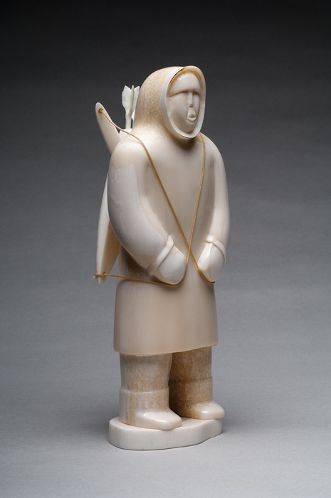 thumbnail of Sculpture made out of walrus ivory by Anders Apassingok Jr. titled Gambell, St. Lawrence Island- Hunter with Bow and Arrows.