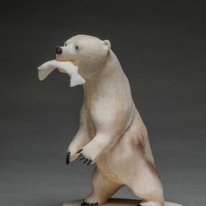 thumbnail of Scultpure of a bear with a fish in its mouth made out of ivory
