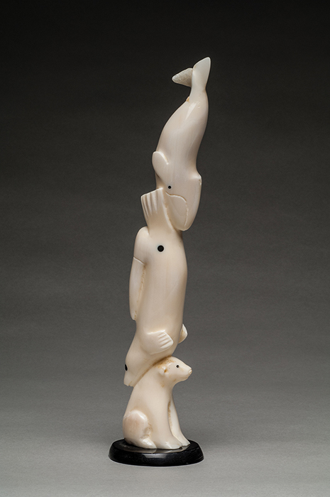 thumbnail of Sculpture made out of walrus ivory by Ronald Apangalook titled Gambell/Anchorage Whale Shaman.