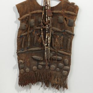 thumbnail of Hunter’s Shirt with Amulets from West Africa. medium: woven raffia, leather, horns. dimensions: height of 27 inches. date: unknown
