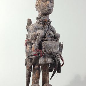 thumbnail of Female Bocio Figure (Back) from Republic of Benin. medium: wood, clothing, bottle, horn, twine, white pigment. dimensions: height of 26 inches. date: unknown