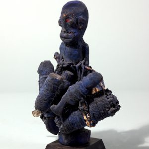 thumbnail of Blue bocio figure with small figures from Republic of Benin. medium: Wood, bottle, twine, cowries, blue pigment. dimensions: height of 29 inches. date: unknown
