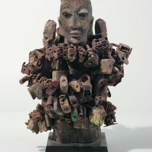 thumbnail of Bocio with padlocks from Republic of Benin. medium: wood, metals. dimensions: height of 14.5 inches. date: unknown.
