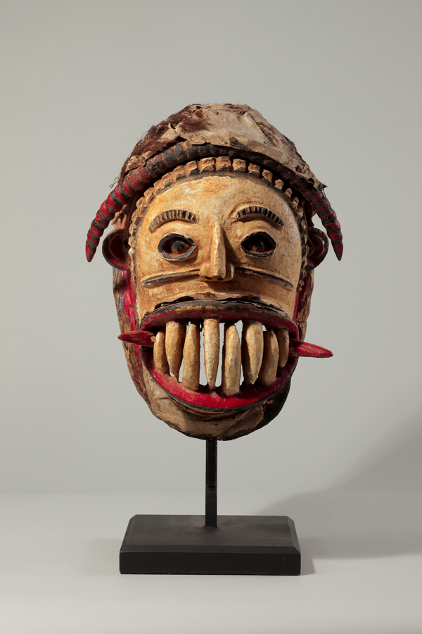 thumbnail of Agaba mask from Igbo, Nigeria. medium: Wood, leather, white, red and black enamel. dimensions: height of 14 inches. date: unknown
