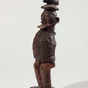 thumbnail of Protective figure from Songye, Democratic Republic of Congo. medium: Wood, cowries, metal, raffia, poles. dimensions: 18 x 30 inches. date: unknown