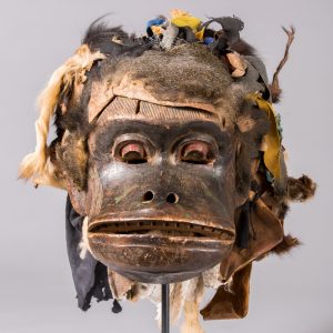 thumbnail of Ceremonial Mask from Western Grassfields, Bamileke: Bamena. medium: Wood, animal hide with fur, cloth, burlap sack, pigment. date: early 20th century
