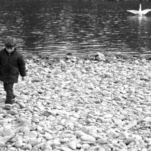 thumbnail of A boy walking away from water