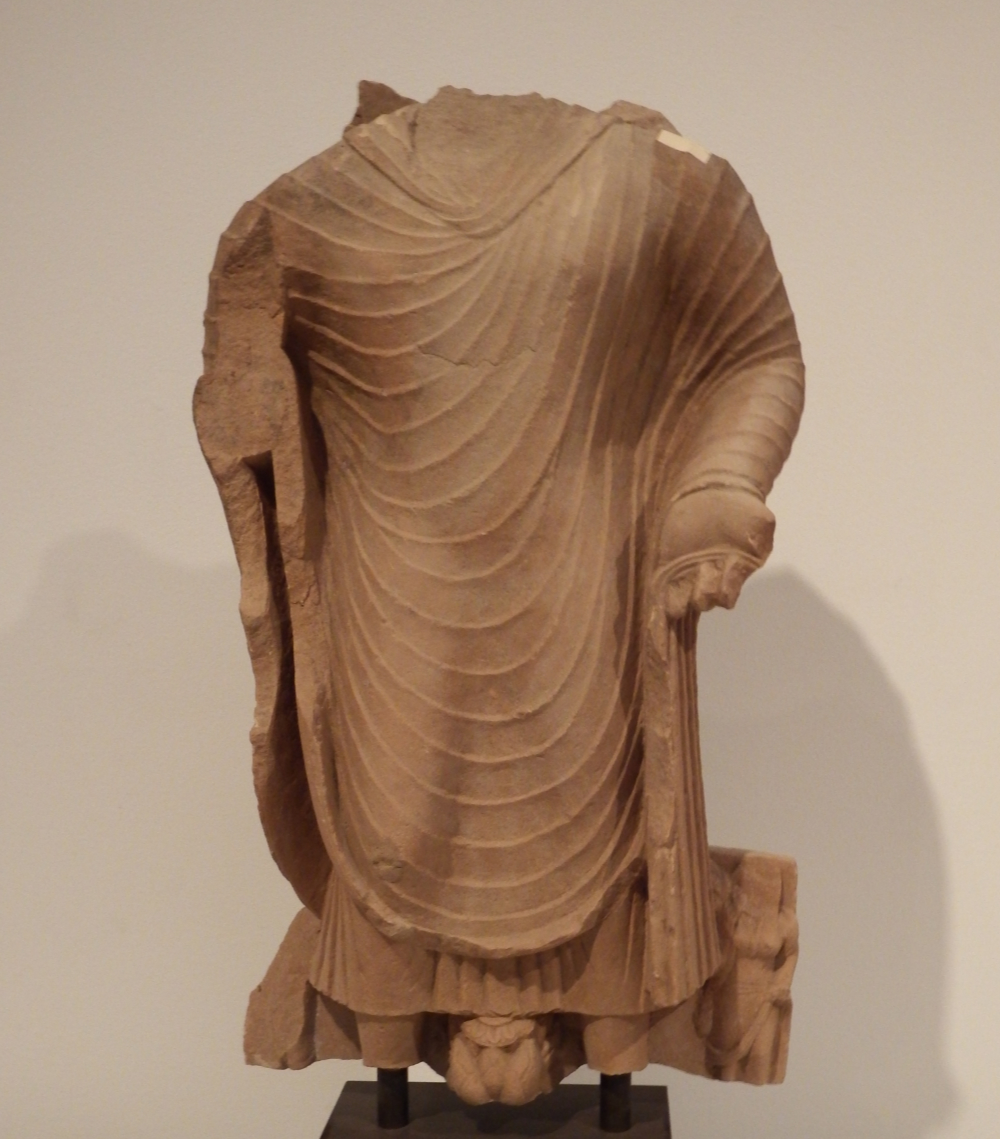 thumbnail of Buddha Torso from Mathura region. medium: red sandstone. date: 275 A.D.