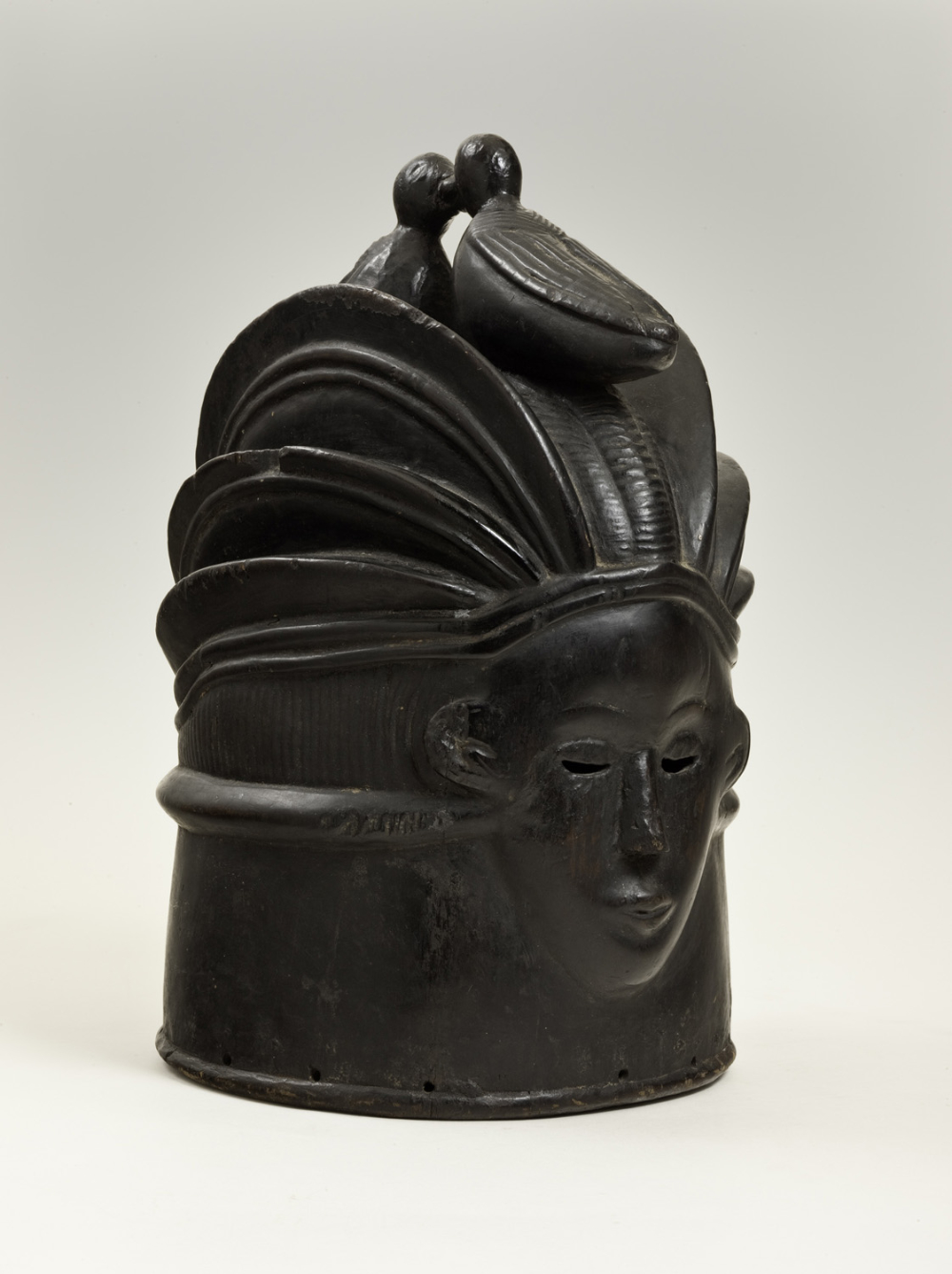 thumbnail of Helmet mask (sowei) from Mende, Sierra. medium: wood, black. dimensions: 16 x 8 inches