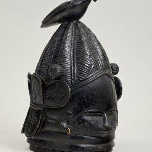 thumbnail of Helmet mask (sowei) from Mende, Sierra Leone. medium: wood, black. dimensions: 16 x 10 inches