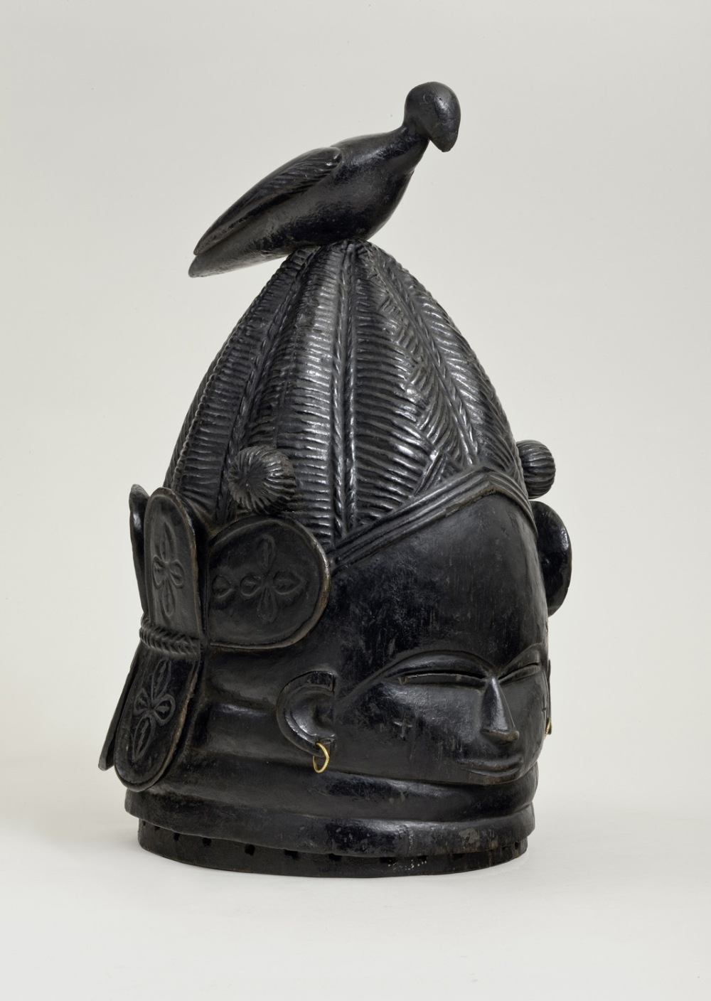 thumbnail of Helmet mask (sowei) from Mende, Sierra Leone. medium: wood, black. dimensions: 16 x 10 inches