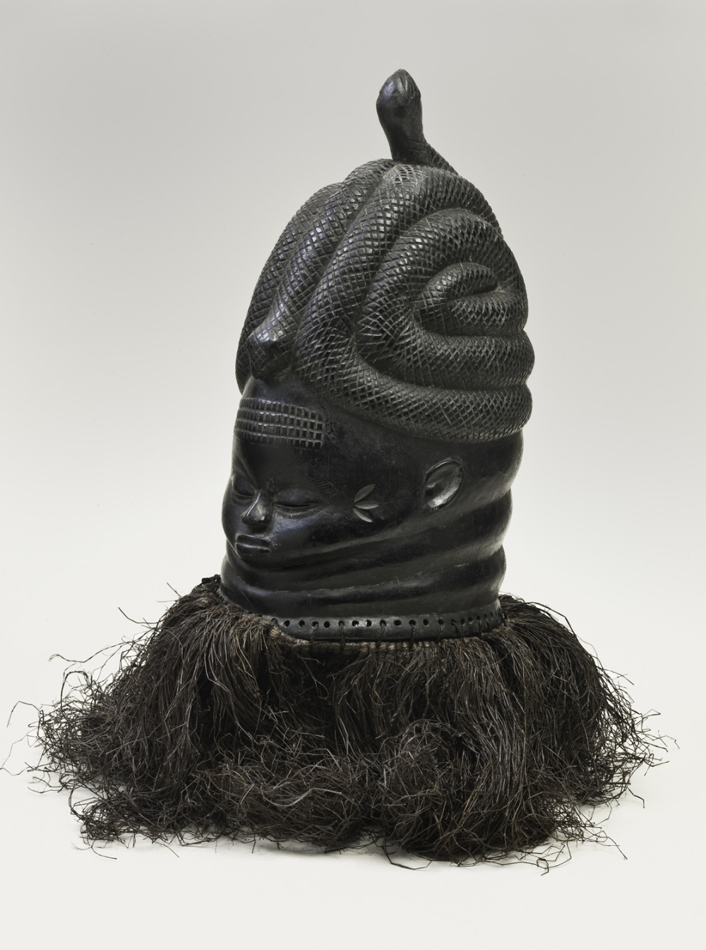 thumbnail of Helmet mask (sowei) from Mende, Sierra Leone. medium: wood, black. dimensions: 15.5 x 8 inches