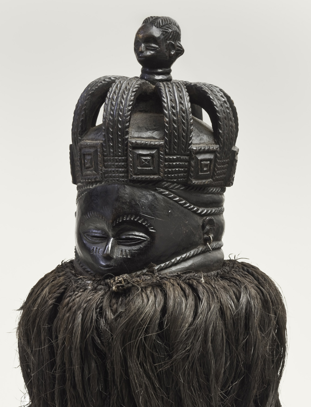 thumbnail of Helmet mask (sowei) from Mende, Sierra Leone. medium: wood, black. dimensions: 14.5 x 9.5 inches