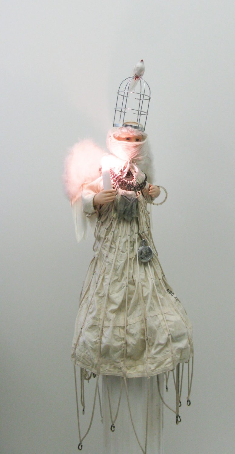 thumbnail of Statue made of multimedia angel with lights, parachute skirt. date: 2011. dimensions: 34 x 17 inches