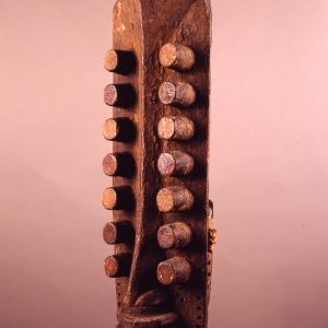 thumbnail of Vertical Mask with 14 'eyes' from Oubi/Grebo complex, Ivory Coast. medium: wood, feather quills. date: unknown. height: 22 inches