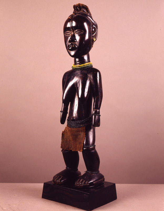 thumbnail of Female Prestige Figure from Dan, Liberia. medium: wood, textile. date: unknown. height: 21 inches