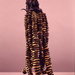 thumbnail of Eshu Dance Wand from Yoruba, Nigeria. medium: Wood, leather, cowrie shells. date: unknown. height: 8 inches