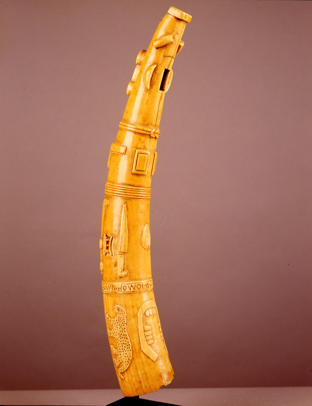thumbnail of Trumpet with Leopard, Hand and Tools from Ewe, Ghana. medium: ivory. date: unknown. height: 23 inches