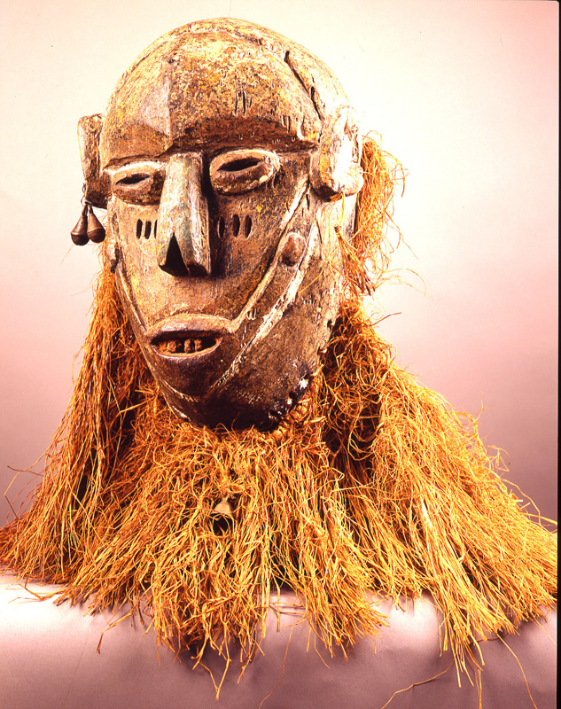 thumbnail of Gongoli Mask from Mende, Sierra Leone. medium: Raffia, metal, white clay, red ocher, enamel. date: unknown. height: 24 inches