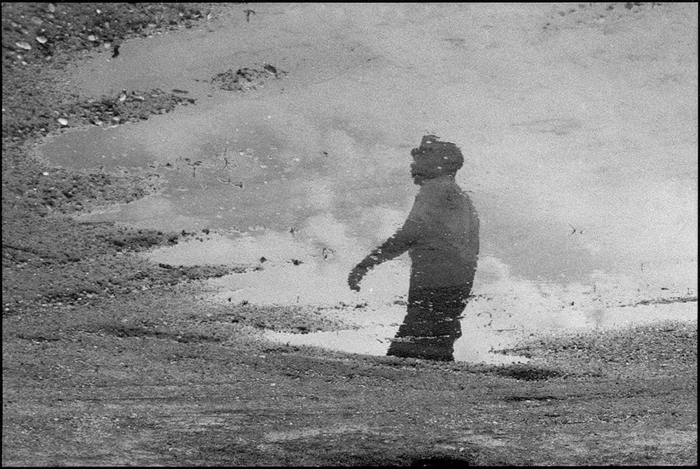 thumbnail of Martin Luther King Jr. Reflected in a Puddle by Dan Budnik. medium: silver gelatin print. date: March, 1965. dimensions: 5 x 8.375 inches