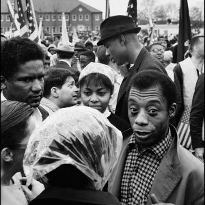 thumbnail of James Baldwin, James Formass on left speaking to fellow marchers by Dan Budnik. medium: silver gelatin print. date: March, 1965. dimensions: 12 x 8 inches