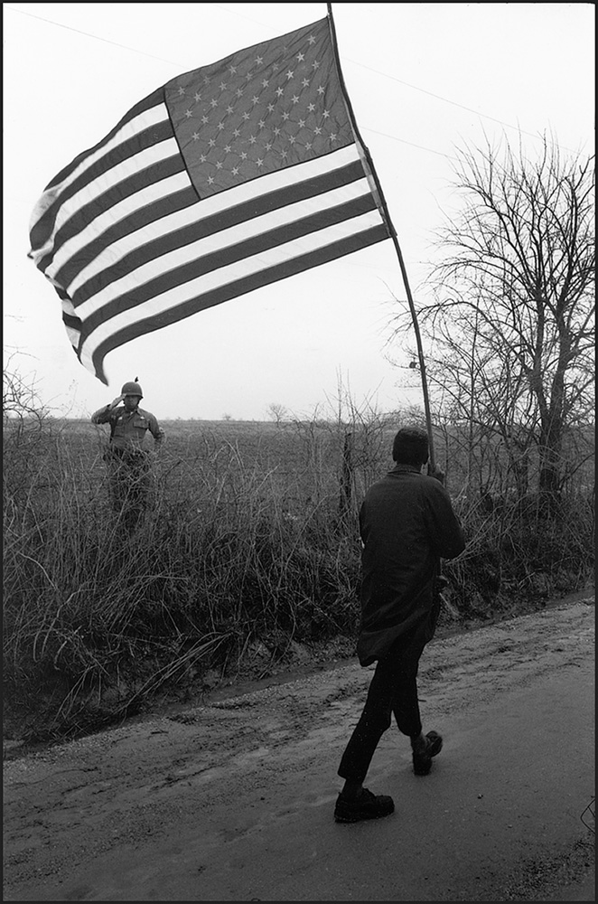 thumbnail of Solo Teenager, Will Henry Rogers being saluted by a sergeant of Alabama national Guard by Dan Budnik. medium: silver gelatin print. date: March, 1965. dimensions: 11.875 x 7.875 inches