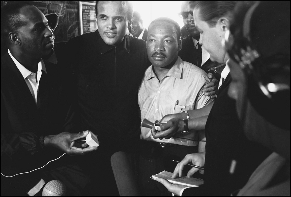 thumbnail of Holding Airport News Conference, Nipsy Russel, Harry Belafonte and Martin Luther King Jr. by Dan Budnik. medium: silver gelatin print. date: March, 1965. dimensions: 8.25 x 12 inches