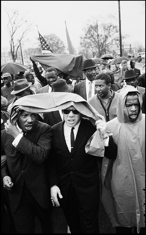 thumbnail of Martin Luther King Jr., S.L. Douglas & John Lewis matching to the courthouse by Dan Budnik. medium: silver gelatin print. date: unknown. dimensions: 11.75 x 7.875 inches