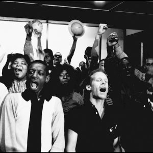 thumbnail of Student non-violent coordinating committee (SNCC) members singing freedom songs, Bealah baptist church by Dan Budnik. medium: silver gelatin print. date: March, 1965. dimensions: 8.5 x 12 inches