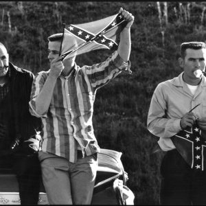 thumbnail of Segregationists using confederate flags to protest the Montegory march by Dan Budnik. medium: silver gelatin print. date: March, 1965. dimensions: 8.25 x 12.25 inches