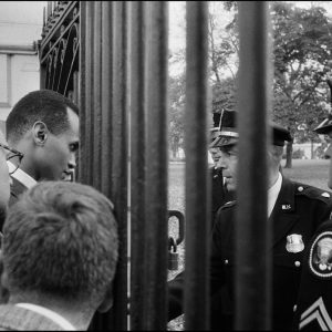 thumbnail of Youth march for Integrated Schools- Harry Belafonte confronted by White House police by Dan Budnik. medium: silver gelatin print. date: October, 1958. dimensions: 10.75 x 13.75 inches