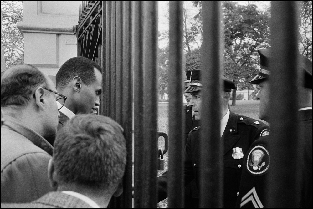 thumbnail of Youth march for Integrated Schools- Harry Belafonte confronted by White House police by Dan Budnik. medium: silver gelatin print. date: October, 1958. dimensions: 10.75 x 13.75 inches