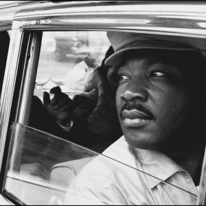 thumbnail of Martin Luther King Jr. with his brother A.D. King at the Montgomery Municipal Airport by Dan Budnik. medium: silver gelatin print. date: March, 1965. dimensions: 11 x 16.5 inches
