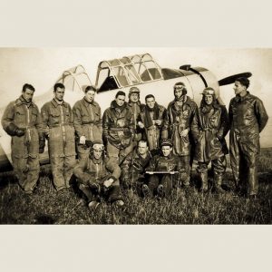 thumbnail of The Deblencourt Team Comrades in Front of their Plane by artist Patricia Dreyfus. medium: c-print. date: 1942. dimensions: 12.96 x 18.84 inches