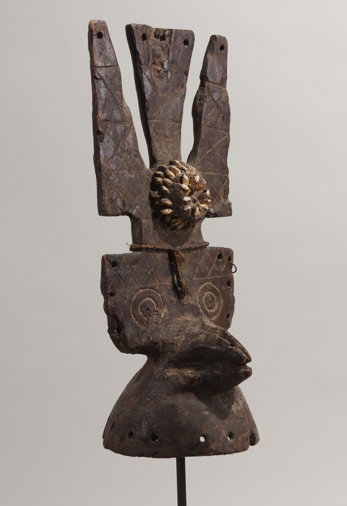 thumbnail of Bird Headpiece from Nuna, Burkina Faso. medium: wood, pigment, cowries, metal, wax, cord. date: unknown. dimensions: unknown